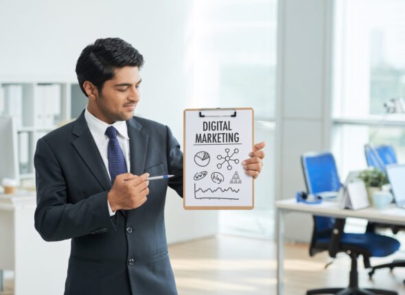 man-suit-standing-office-with-clipboard-pointing-poster-with-words